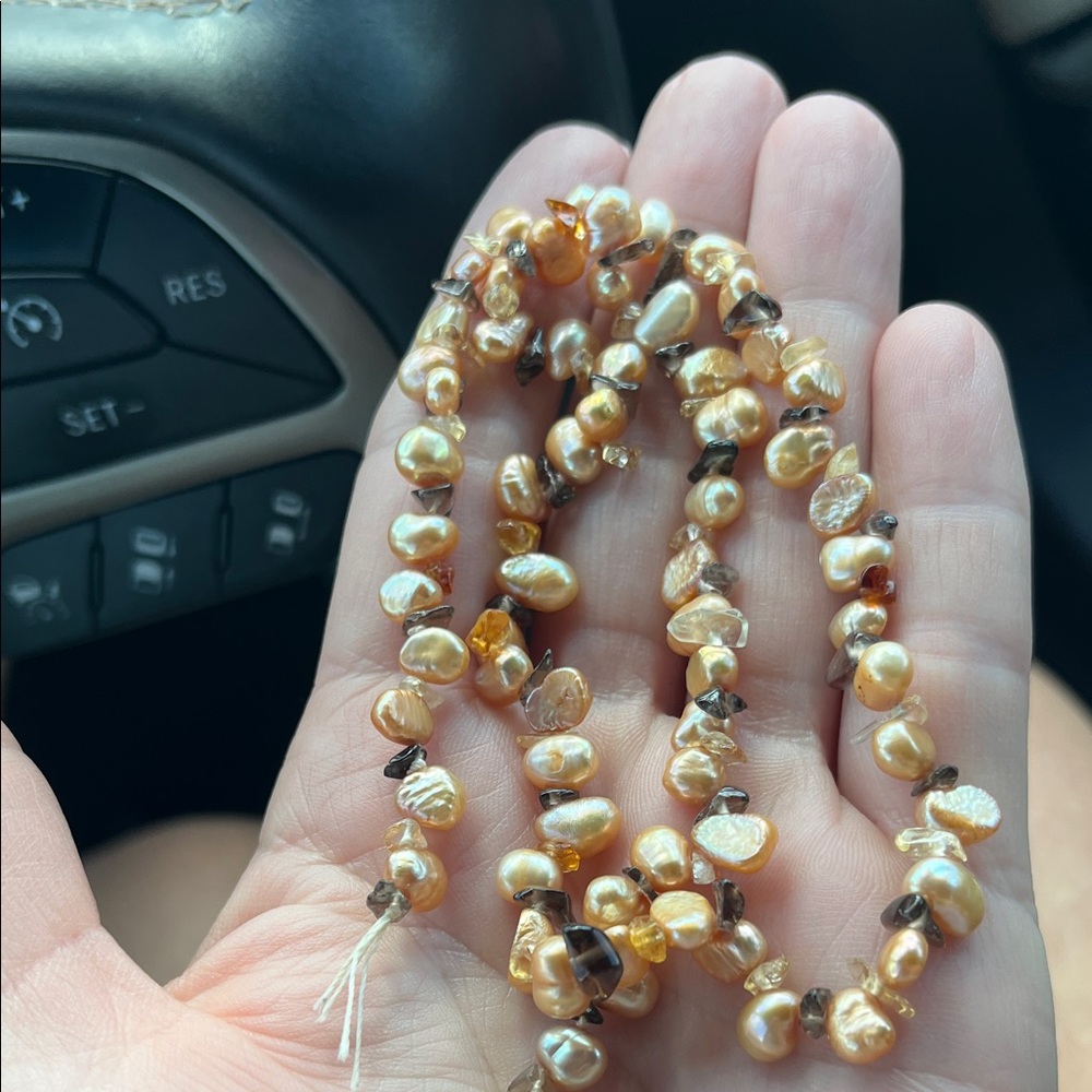 Peach colored freshwater pearls strand with stone chips